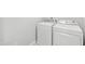 The laundry room has a white washer and dryer set, and light-colored vinyl flooring at 2309 Filigree Ct, Raleigh, NC 27614