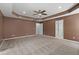 Spacious main bedroom with ceiling fan, neutral carpet, and recessed lighting at 2309 Filigree Ct, Raleigh, NC 27614