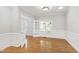 Bright office features hardwood floors, elegant wainscoting detail, and glass French doors at 2309 Filigree Ct, Raleigh, NC 27614