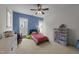 bedroom features a bright blue accent wall and lots of storage space at 2309 Yancey St, Raleigh, NC 27608