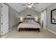 Calm bedroom featuring neutral colors, a ceiling fan, and bedside lamps at 2309 Yancey St, Raleigh, NC 27608