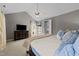 Spacious bedroom with ceiling fan, dresser, and a view of the closet at 2309 Yancey St, Raleigh, NC 27608