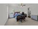 Bedroom with natural light, neutral carpet, and two dressers, providing functionality and charm at 2309 Yancey St, Raleigh, NC 27608