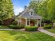 Charming brick clubhouse with manicured landscaping, complemented by lush green lawn at 2309 Yancey St, Raleigh, NC 27608