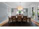 Stylish dining area featuring modern lighting, neutral color palette, and seating for eight at 2309 Yancey St, Raleigh, NC 27608