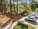 Bright, modern building set back from parking and sign for Kiwanis Park; mature trees throughout at 2309 Yancey St, Raleigh, NC 27608