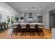 Modern kitchen with stainless steel appliances, an island with seating, and ample cabinet space at 2309 Yancey St, Raleigh, NC 27608