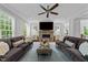 Cozy living room with a stone fireplace, plush seating, and ample natural light at 2309 Yancey St, Raleigh, NC 27608