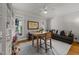 Relaxing living room features a ceiling fan, large windows, and comfortable seating at 2309 Yancey St, Raleigh, NC 27608