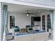 Covered patio featuring comfortable seating and an outdoor ceiling fan for a relaxing experience at 2309 Yancey St, Raleigh, NC 27608