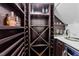 Custom wine cellar with built-in shelving, countertop, and beverage refrigerator at 2309 Yancey St, Raleigh, NC 27608