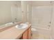 Bathroom featuring a single sink vanity, toilet, and shower-tub combination with tile surround at 2330 Lazy River Dr, Raleigh, NC 27610
