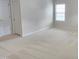 Bedroom with neutral walls, carpet flooring, closet and a large window at 2330 Lazy River Dr, Raleigh, NC 27610