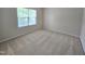 Cozy bedroom with neutral carpet, a window for natural light, and ample closet space at 2330 Lazy River Dr, Raleigh, NC 27610