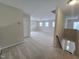 Spacious bonus room with carpet flooring, many windows and staircase at 2330 Lazy River Dr, Raleigh, NC 27610