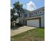 Inviting two-story home featuring a spacious driveway and a beautifully maintained lawn at 2330 Lazy River Dr, Raleigh, NC 27610