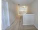 Bright hallway with neutral paint, carpet flooring, and access to upper level rooms at 2330 Lazy River Dr, Raleigh, NC 27610