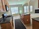 The kitchen has an island with a double sink and views to the living room at 2330 Lazy River Dr, Raleigh, NC 27610