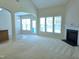 This living room has lots of natural light, a fireplace, and neutral carpet at 2330 Lazy River Dr, Raleigh, NC 27610
