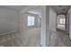 Bright living room featuring neutral carpet, an open floor plan, and natural light at 2330 Lazy River Dr, Raleigh, NC 27610