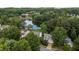 Aerial shot showing the lake, houses and trees at 2441 Deanwood Dr, Raleigh, NC 27615