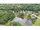 Birds eye view of a cluster of houses and lake at 2441 Deanwood Dr, Raleigh, NC 27615