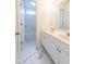 Bright bathroom with a double sink vanity, marble floors, and access to the shower/tub at 2441 Deanwood Dr, Raleigh, NC 27615