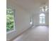 Spacious bedroom with vaulted ceiling, fan, and large windows providing plenty of natural light at 2441 Deanwood Dr, Raleigh, NC 27615