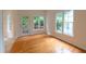 Inviting dining area with hardwood floors and view to an outdoor deck through a glass door at 2441 Deanwood Dr, Raleigh, NC 27615