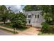 View of the house exterior showing the garage, the front door and foliage at 2441 Deanwood Dr, Raleigh, NC 27615