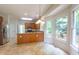 Spacious kitchen with breakfast bar, stainless steel appliances and many windows overlooking deck at 2441 Deanwood Dr, Raleigh, NC 27615