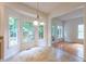 Charming kitchen features a breakfast nook with large bright windows and stylish tile flooring at 2441 Deanwood Dr, Raleigh, NC 27615