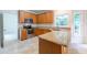 Bright kitchen with stainless steel appliances, granite countertops, and natural light at 2441 Deanwood Dr, Raleigh, NC 27615