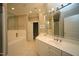 Well-lit bathroom featuring double sink vanity, walk-in shower, and soaking tub at 2901 Market Bridge Ln # 203, Raleigh, NC 27608
