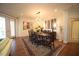 Bright dining room with hardwood floors, area rug, stylish light fixture and seating for ten at 2901 Market Bridge Ln # 203, Raleigh, NC 27608