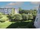 Exterior view showing the lush landscaping and surrounding neighborhood at 2901 Market Bridge Ln # 203, Raleigh, NC 27608