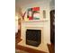 Elegant fireplace with decorative mantel, accentuating the living area's charm at 2901 Market Bridge Ln # 203, Raleigh, NC 27608