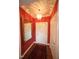 Charming foyer with stylish wallpaper, decorative mirror, and hardwood floors at 2901 Market Bridge Ln # 203, Raleigh, NC 27608