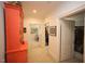 Hallway featuring colorful decor, access to walk-in closet, and multiple doorways at 2901 Market Bridge Ln # 203, Raleigh, NC 27608