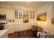 Charming kitchen with white cabinets, stainless steel appliances, a breakfast nook, and hardwood floors at 2901 Market Bridge Ln # 203, Raleigh, NC 27608