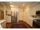 Bright kitchen with white cabinets, stainless appliances, and hardwood floors, offering a modern and functional space at 2901 Market Bridge Ln # 203, Raleigh, NC 27608