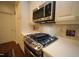 Updated kitchen features stainless steel appliances, granite countertops, and ample cabinet space, creating a chef's haven at 2901 Market Bridge Ln # 203, Raleigh, NC 27608