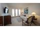 Cozy living room with decorative chair and a white sofa near bright French doors at 2901 Market Bridge Ln # 203, Raleigh, NC 27608