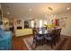 Spacious living and dining area with hardwood floors, stylish lighting, and ample seating at 2901 Market Bridge Ln # 203, Raleigh, NC 27608
