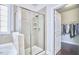 Bathroom featuring walk-in shower, soaking tub, and a walk-in closet at 2916 Reynolda Cir, Durham, NC 27712