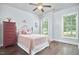 Bedroom featuring hardwood floors, ceiling fan, and large windows at 2916 Reynolda Cir, Durham, NC 27712