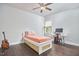 Bedroom with hardwood floors, ceiling fan, and a twin sized bed at 2916 Reynolda Cir, Durham, NC 27712