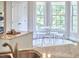 Bright breakfast nook features a round table, modern chairs, and lots of natural light from large windows at 2916 Reynolda Cir, Durham, NC 27712