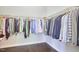 Well-organized walk-in closet with ample hanging space and hardwood floors at 2916 Reynolda Cir, Durham, NC 27712