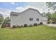 Large home with gray siding, well-maintained lawn, and a rear wooden deck at 2916 Reynolda Cir, Durham, NC 27712